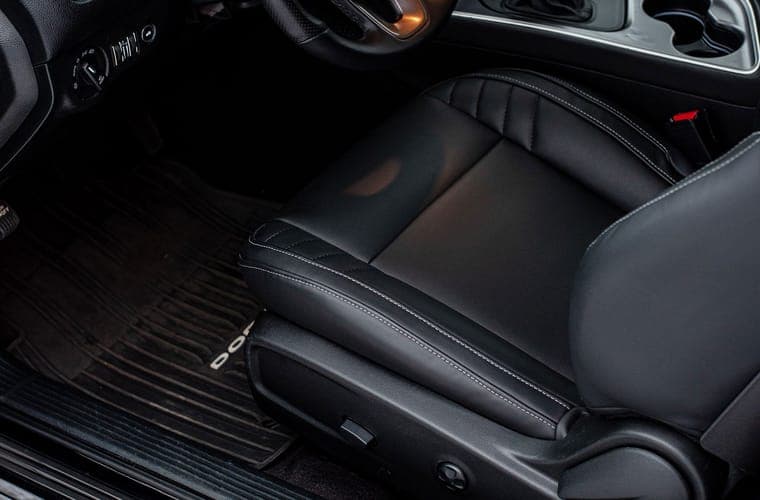 Car cabin with leather seats and the front footwell in frame